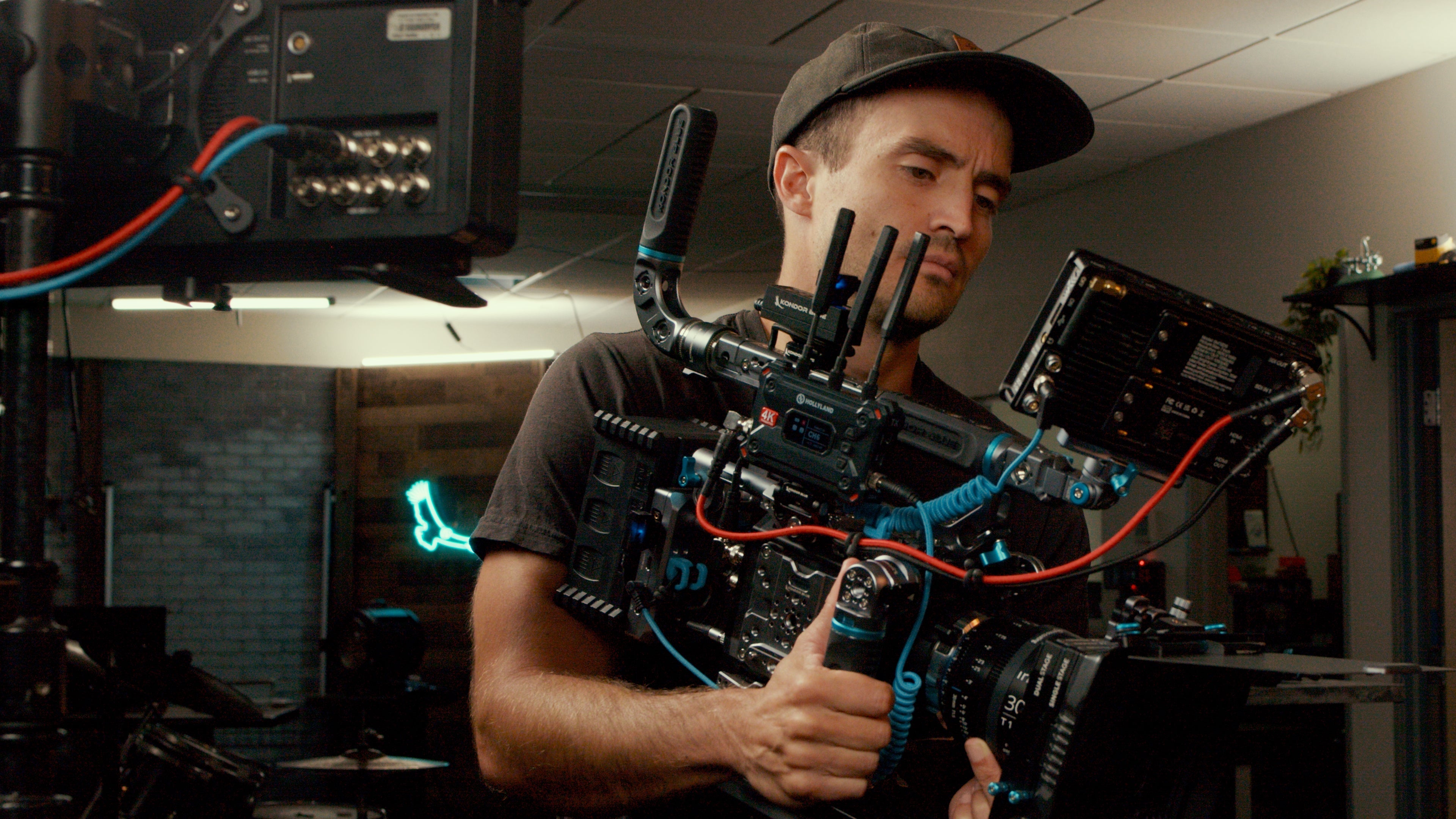 Assorted KONDOR BLUE SDI cables with right-angle and straight connectors for professional video production