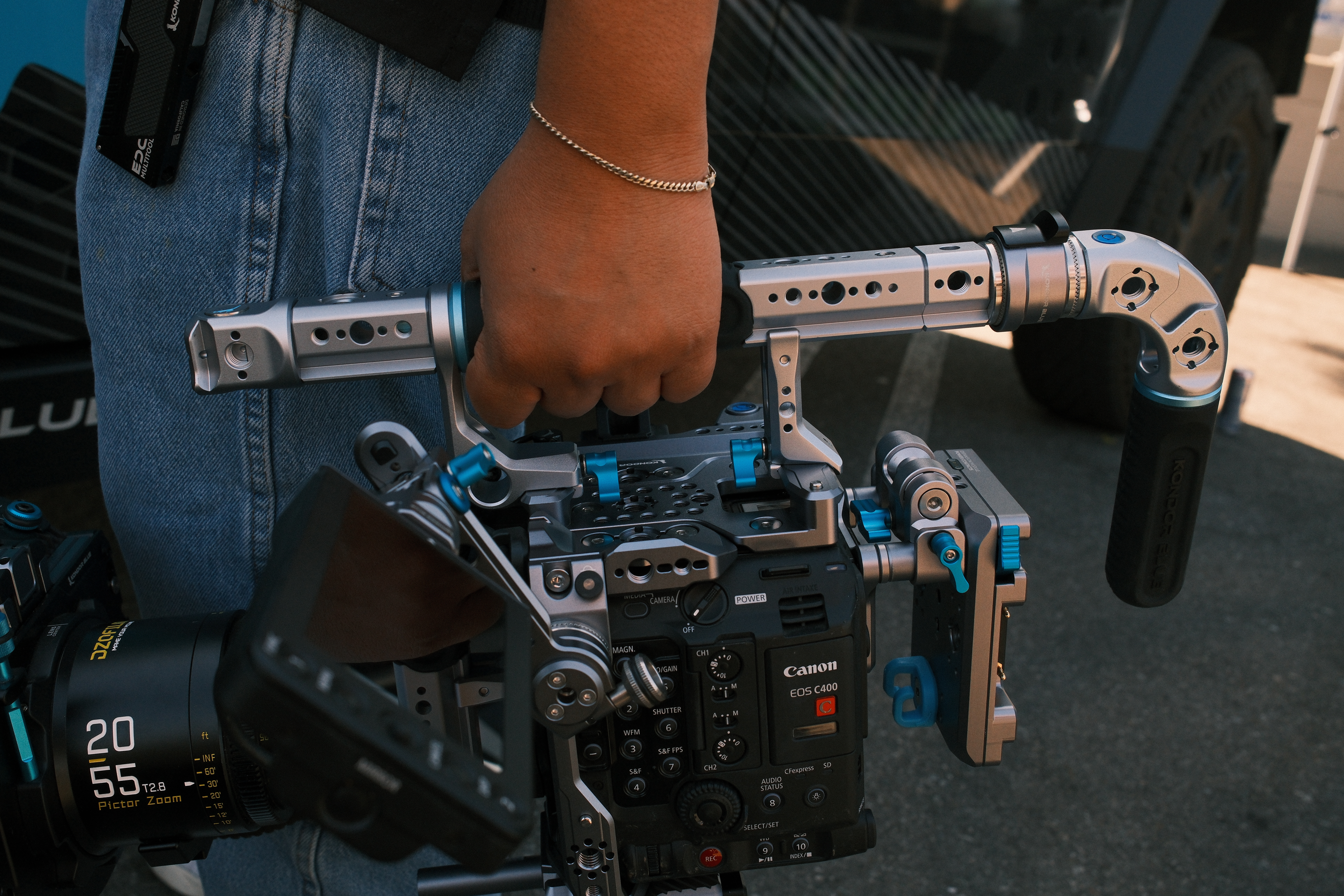Assorted professional camera handles and grips by Kondor Blue mounted on cinema cameras in a production setup.